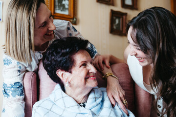Three generations of women sharing love and happiness at home