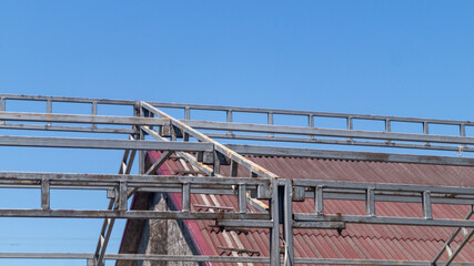 Grey metal frame for a large awning, tent. Metal frame closeup