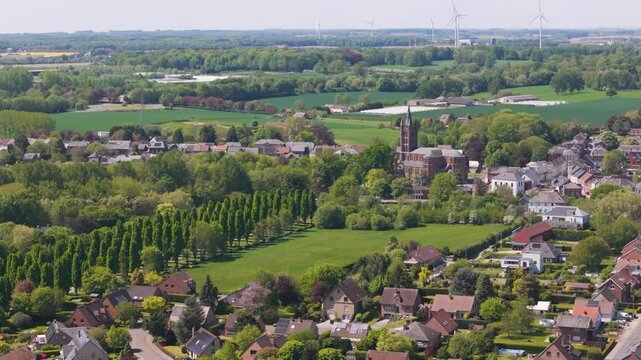 to seneffe town colorful buildings architecture church end visible windmills background enhance scenic reveal pulls aerial drone back belgium showcasing beauty 