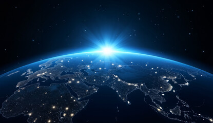 Obraz premium Earth from Space at Night with Sun Rising Over the Horizon