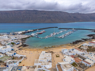 Caleta del Sebo, the main town of La Graciosa island, presents a charming, peaceful scene in aerial views.