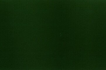 Old film grain creating a textured green background
