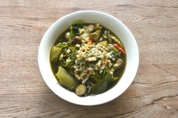 sweet Melientha suavis and mixed vegetable with red ant egg in fermenting fish sauce curry soup on bowl