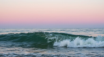 Ocean wave breaking with pink and purple sky at sunset or sunrise scenery view