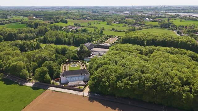ch&acirc;teau seneffe surrounding areas scene green cover parks vast area distant windmills bird's eye aerial drone view of de belgium 