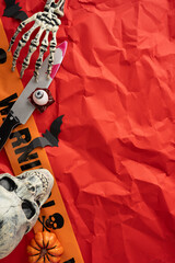 Celebratory Halloween-themed vertical composition featuring spooky elements like skull, skeleton...