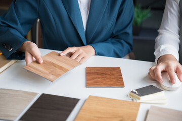 Interior designers brainstorming creative design ideas for modern home in collaborative meetingใ