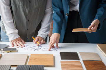Interior designers brainstorming creative design ideas for modern home in collaborative meetingใ