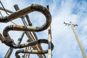 Overhead curved pipes