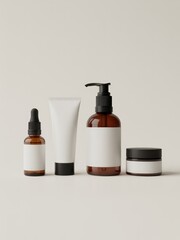 A minimalist arrangement of four skincare products with blank labels on a neutral background