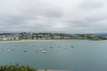 view of the city of San Sebastian, with La Concha beach, from Mount Urgull. Summer vacation scene...