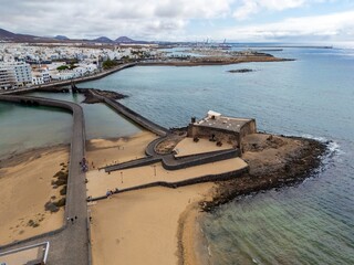 Arrecife in Lanzarote, aerial view of town, fortress and sandy beach