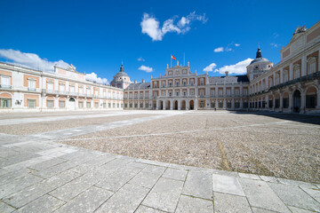 Fototapeta premium Historical architecture of Royal Palace in Aranjuez, Spain under a clear blue sky