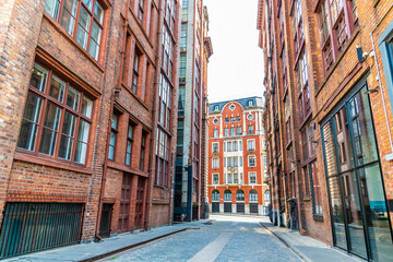 A view down a side street forming an urban canyon  in Manchester,UK in summertime