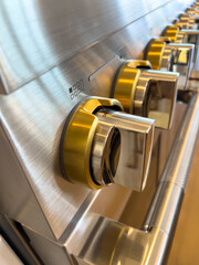 Brass and Steel Knobs on Gas Range