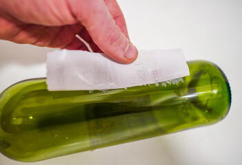 Removing label from bottle. Removing Wine Bottle Labels. Remove Old Wine Label. Sticker removers....