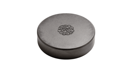 A flat steel paperweight with etched logo variant 1077, white background --ar 16:9