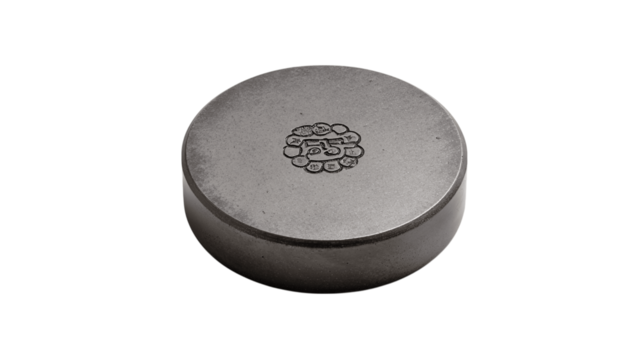 A flat steel paperweight with etched logo variant 1077, white background --ar 16:9