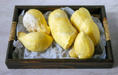A yellow durian that has been peeled off to reveal the tasty yellow flesh of the durian. Durian...