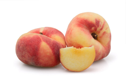 Fig peaches isolated on white background. Fig peach has many names - flat peach, saucer peach, peach donut, etc.