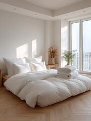 Modern bright bedroom with large floor-to-ceiling white bedding and minimalist decor in a contemporary home interior design