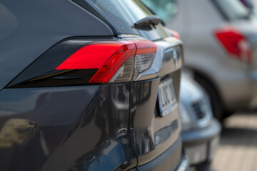 Modern vehicles parked closely together in a busy urban environment during daylight
