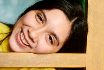 Happy teenager girl smiling joyfully.