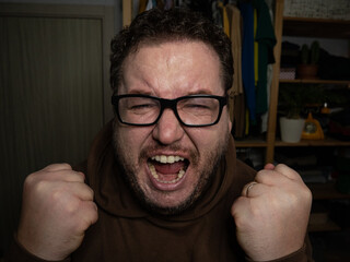 A grown man screams and swears