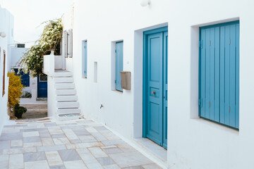 Blue shutters on whitewashed house in Milos island, Greece