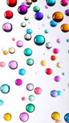 Colorful, glossy spheres cascade against white background