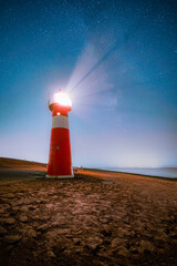 Galaxy at a lighthouse at the dutch coast
