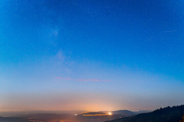 Night time sky with starlight and milky way galaxy