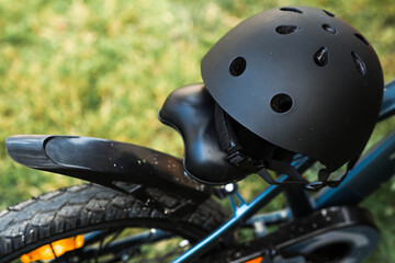 Bike and safety helmet outdoors. Active sport. Protection. Life insurance and children's safety.