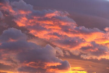 Burning dramatic colorful clouds in beautiful sunset