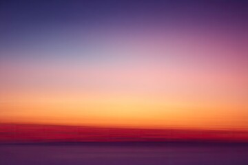 Obraz premium Blurry sunset sky, vibrant colors, soft focus