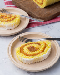 Roll cake or swiss cake filled with dulce de leche