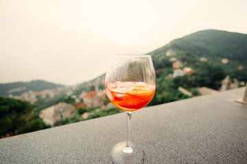 Refreshing spritz cocktail enjoying scenic hilltop view in italy