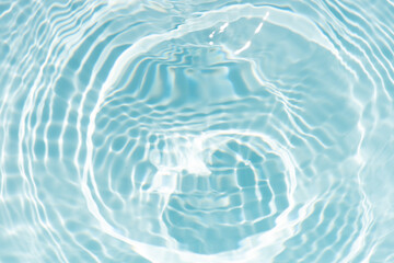 Blue water with ripples on the surface. Defocus blurred transparent blue colored clear calm water...