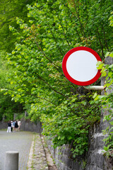Vibrant road sign with a red border is designed to warn the driver about a section of the road with a high concentration of accidents