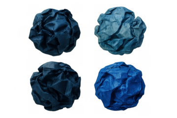 Crumpled blue paper balls positioned systematically, highlighting surface texture against translucent backdrop
