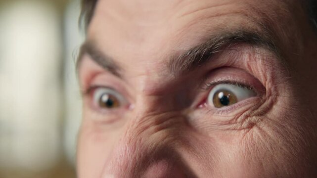 Close up crazy man eyes mad angry insane furious annoyed emotional guy middle-aged businessman business worker anger screaming shouting madness negative agression yelling scream problem fight stress