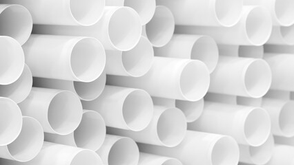 Stack of white tubes. tubes are white and stacked on top of each other.  tubes are same size and...
