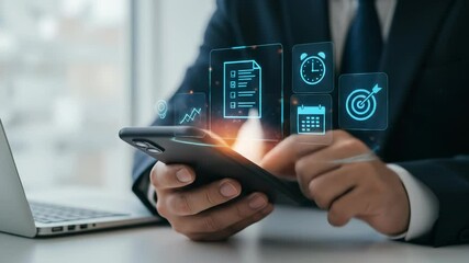 Adult businessman uses a smartphone with glowing holographic icons for strategic digital business management, efficient time planning, and productivity in a modern office setting. - Powered by Adobe