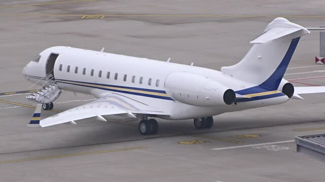 private jet prepares for departure stairs closed airport tarmac scene reflects high end luxury vip millionaire lifestyle zurich aviation 