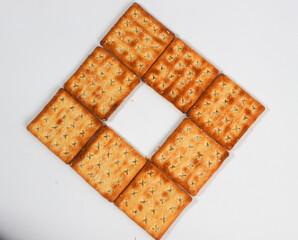 isolated square sweet cracker with sprinkled sugar on top on white background