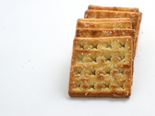isolated square sweet cracker with sprinkled sugar on top on white background