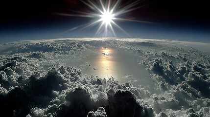 A view of clouds from above, with the sun shining brightly.