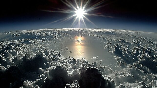 A view of clouds from above, with the sun shining brightly.