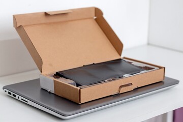 Laptop battery spare parts. Replacing a damaged laptop battery.