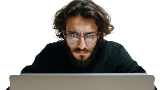 Focused young man analyzing data on laptop, intense concentration, white isolated background.